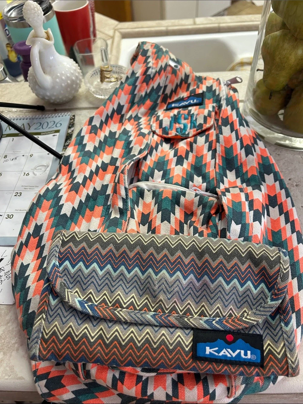 Kavu Chevron Sling Backpack in Coral, Teal & White With Wallet